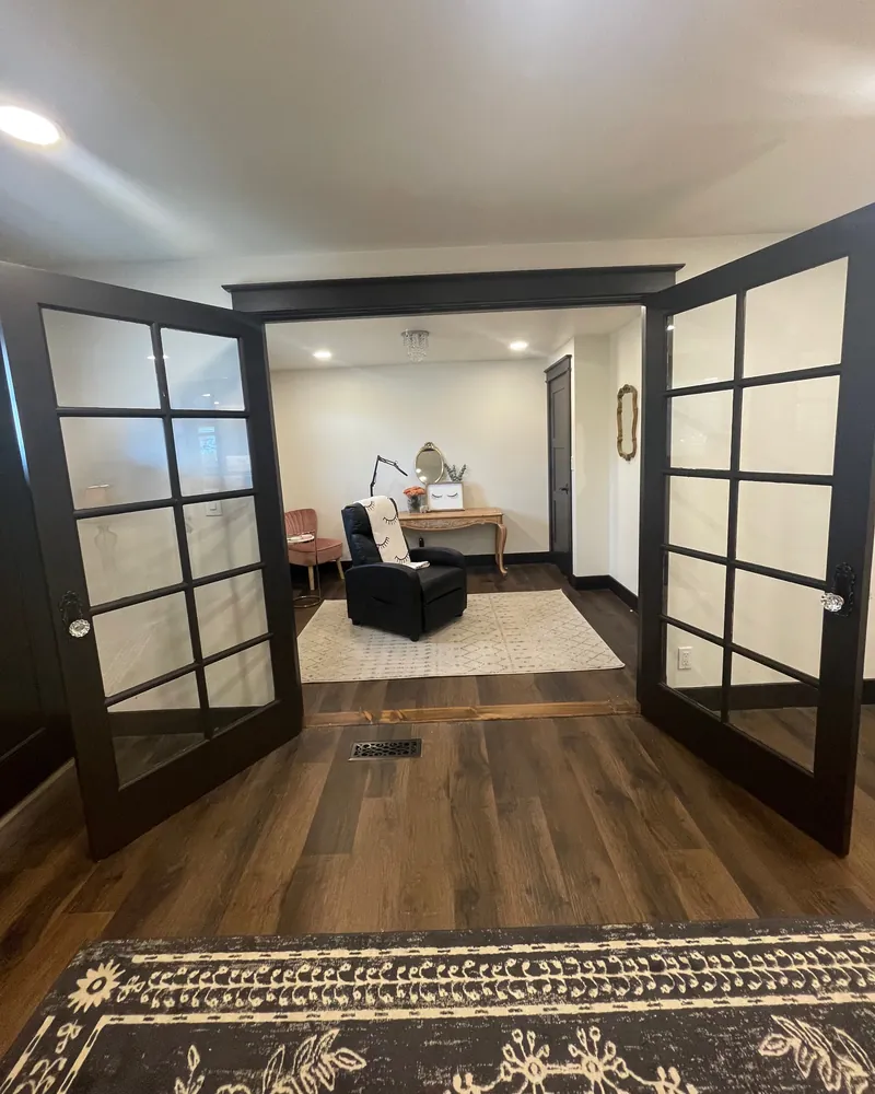 The treatment room seen through open French doors