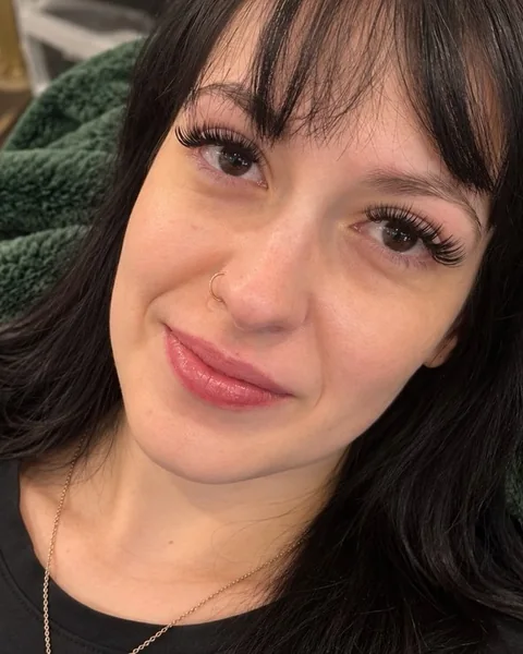 A Sage & Lash client in the lash recliner after her lash extension appointment