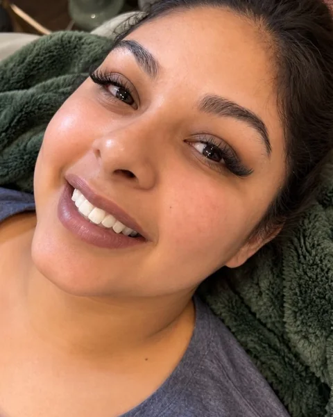 A Sage & Lash client in the lash recliner after her lash extension appointment