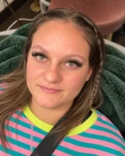 A Sage & Lash client in the lash recliner after her lash extension appointment