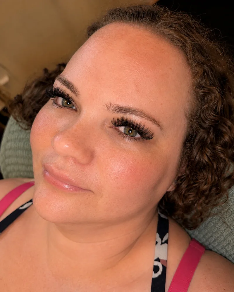 A Sage & Lash client wearing a full volume lash set